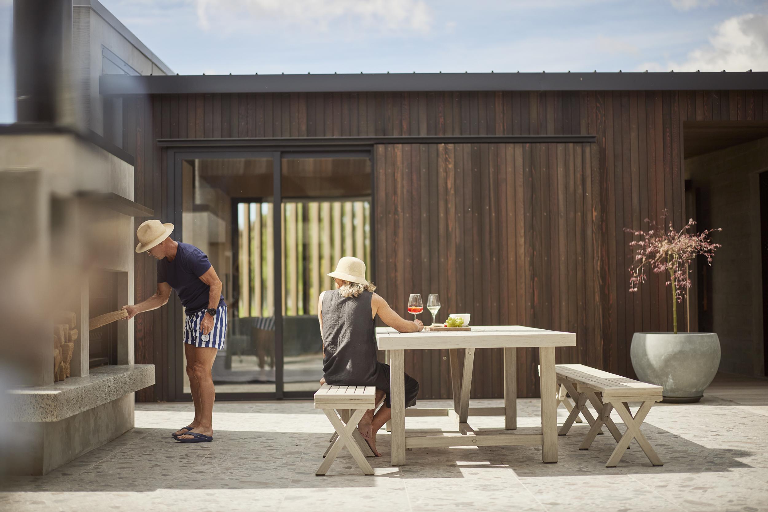 Stoaking the outdoor fire BOON